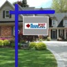 blue real estate sign post