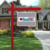 red real estate sign post